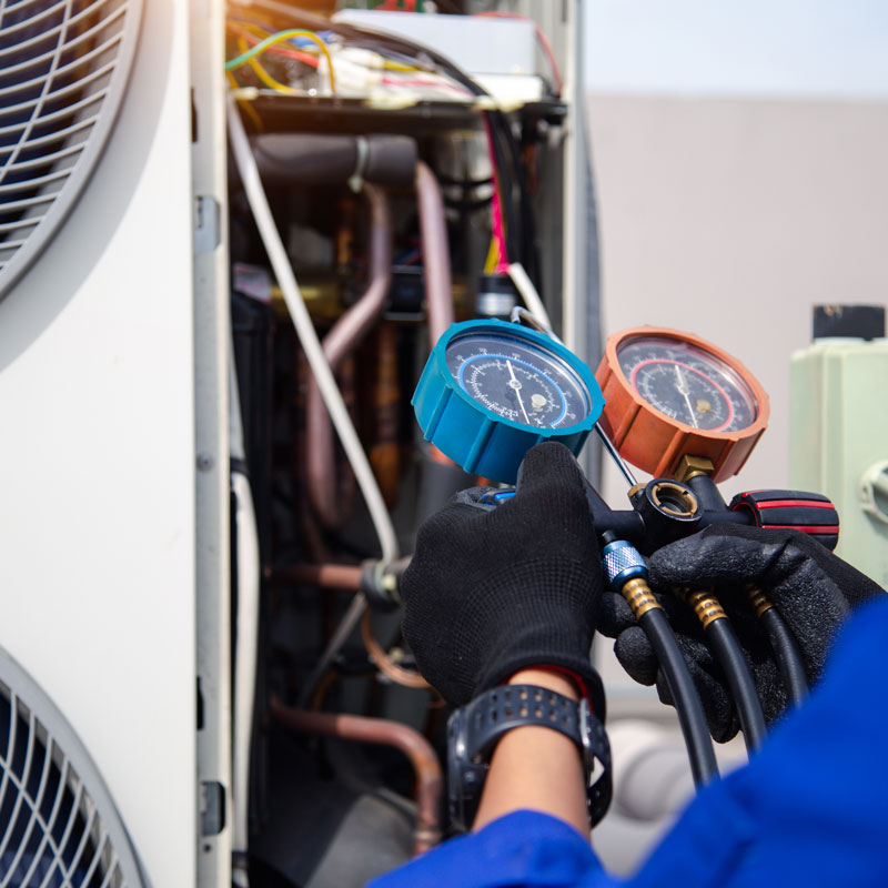 someone testing a air conditioning unit